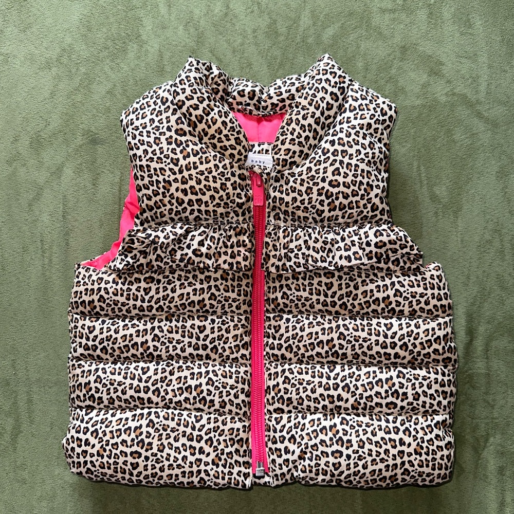 Toddler cheetah print vest with hot pink liner.